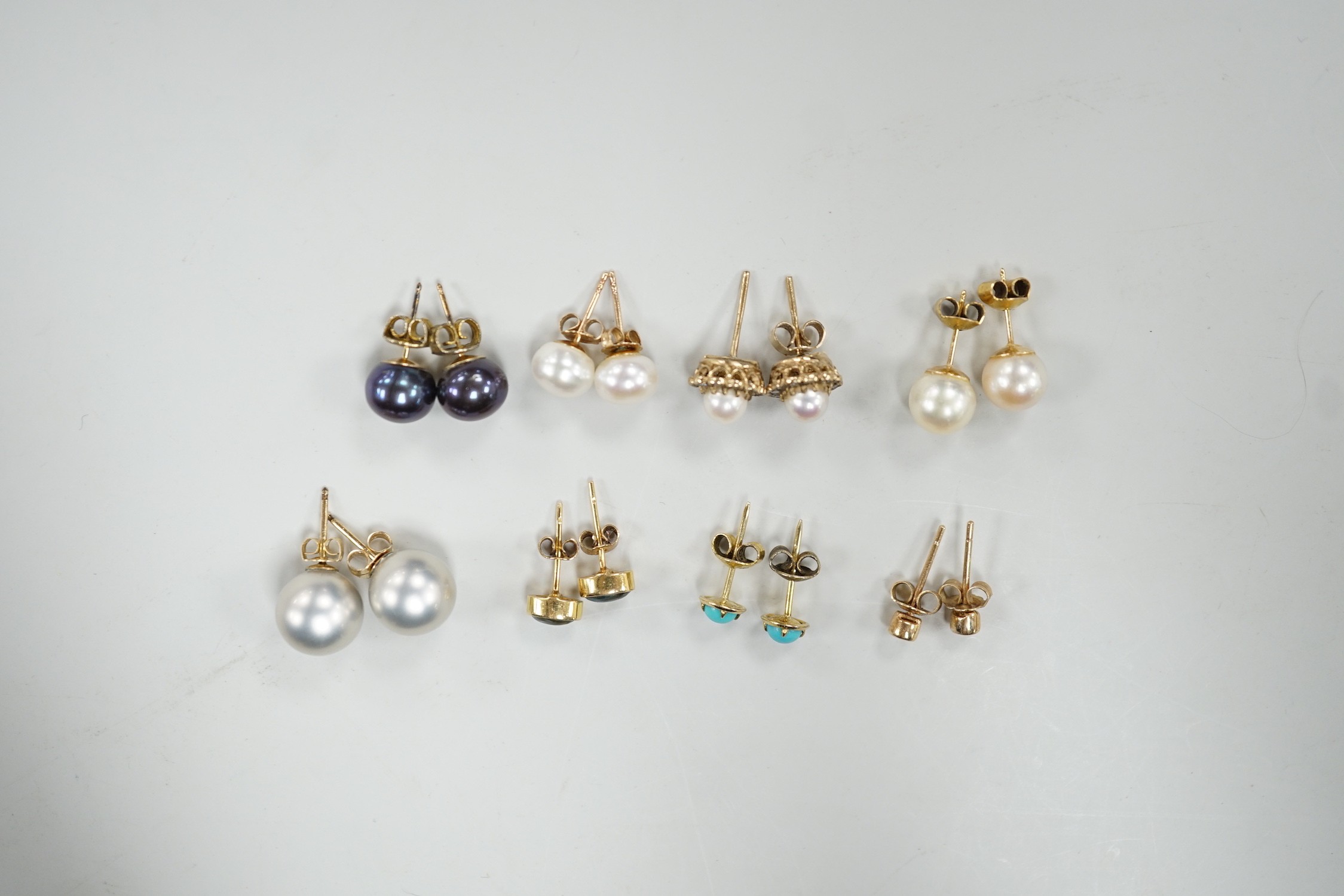 Eight assorted modern pairs of ear studs, including a 14k and cultured pearl and two other cultured pearl, one 9ct and diamond chip.